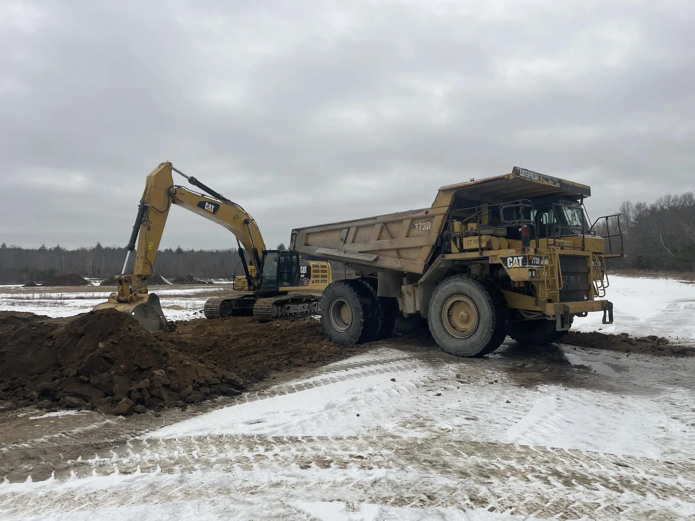 Dubois excavator loading a dump truck