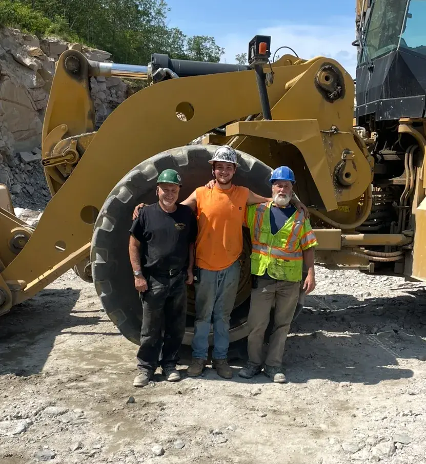 The Dubois crew in front of a wheel loader at the Lyman pit in Maine