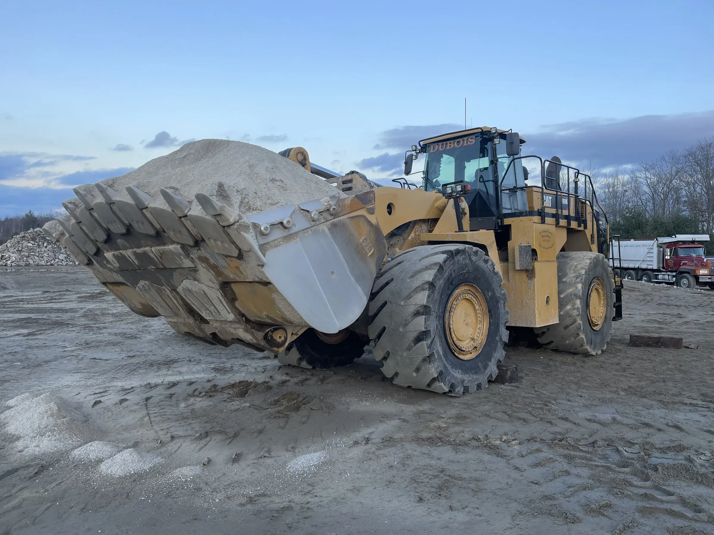 Dubois CAT wheel loader with a full bucket of sand